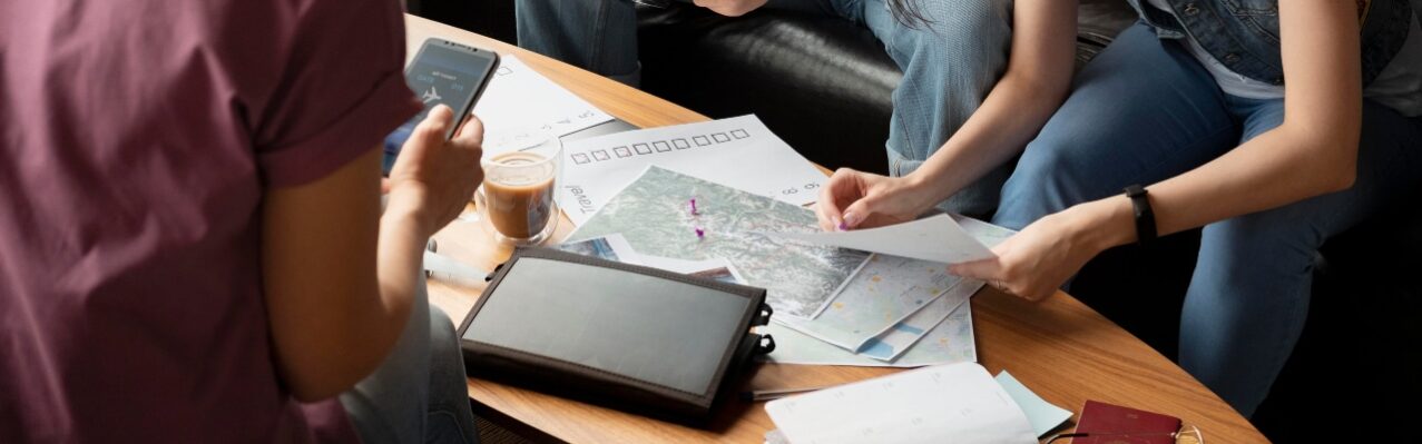 close-up-friends-planning-trip