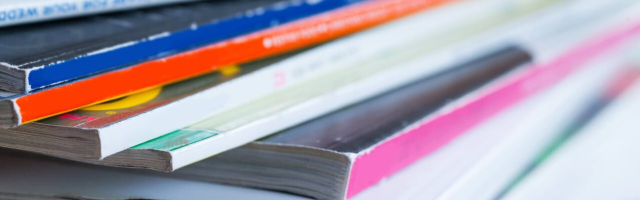 pile-colorful-magazines-table