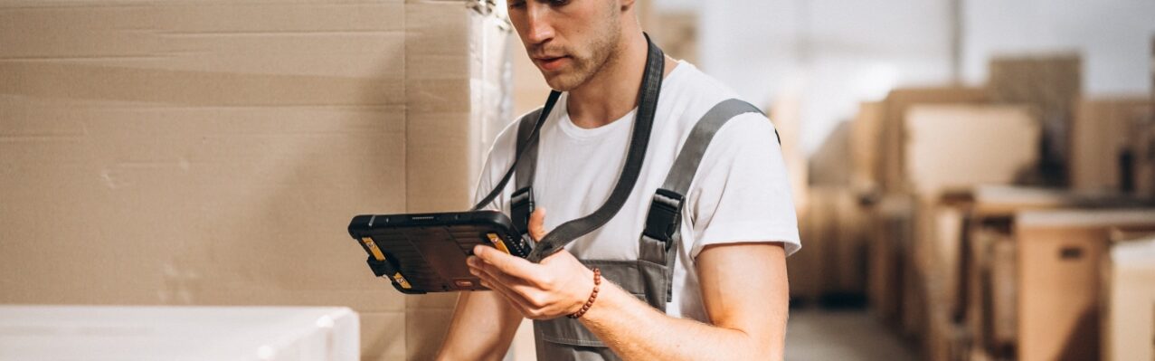 young-man-working-warehouse-with-boxes.jpg