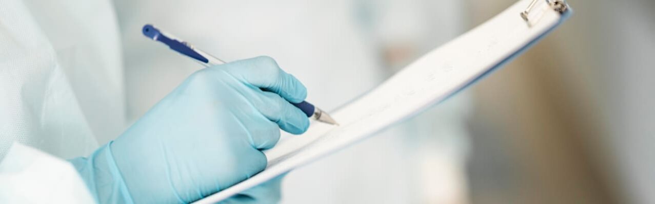 close-up-doctors-completing-medical-form.jpg