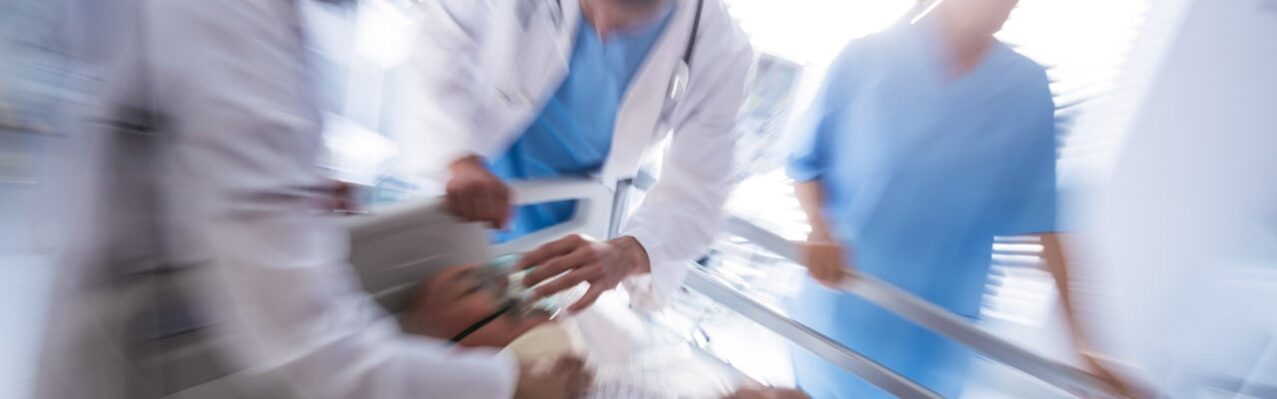 team-doctors-putting-oxygen-mask-male-senior-patient-face.jpg