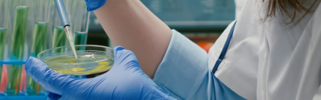 chemist-woman-taking-dna-liquid-from-test-tube-with-micropipette-putting-petri-dish-analyzing-genetic-mutation.jpg