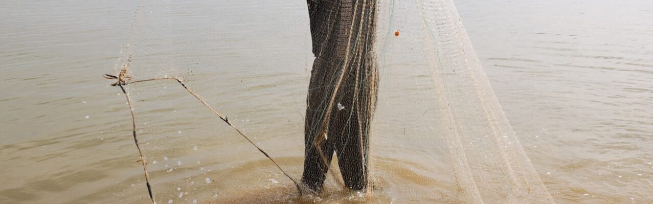 fisherman-with-net-river.jpg