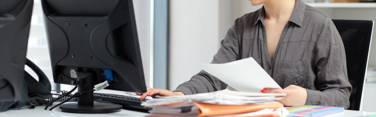 front-view-young-beautiful-lady-grey-shirt-working-with-documents-laptop-sitting-inside-her-office-daytime-building-job-activity.jpg