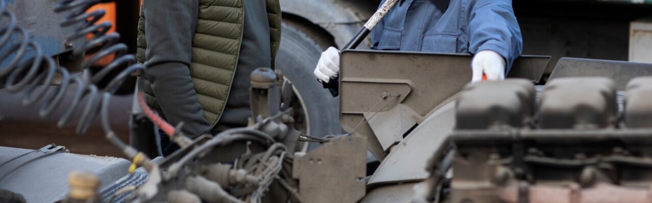 medium-shot-men-looking-inside-truck.jpg