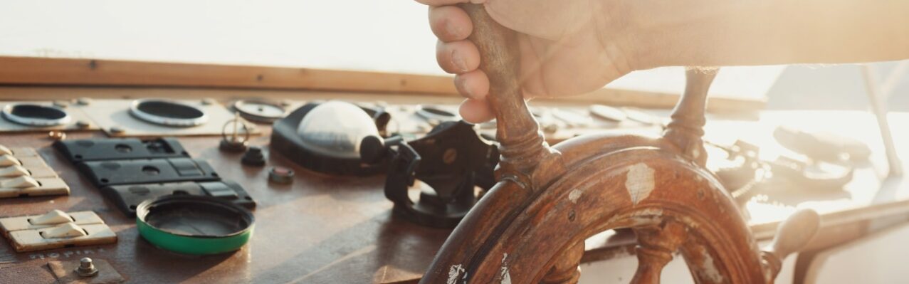 sun-shines-wooden-wheel-held-by-man.jpg