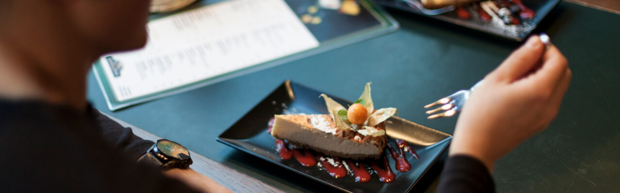 crop-man-eating-dessert-cafe.jpg