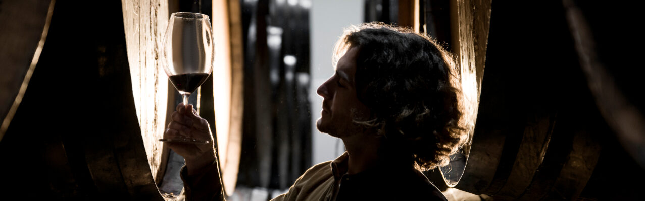 side-view-man-looking-wine-glass.jpg