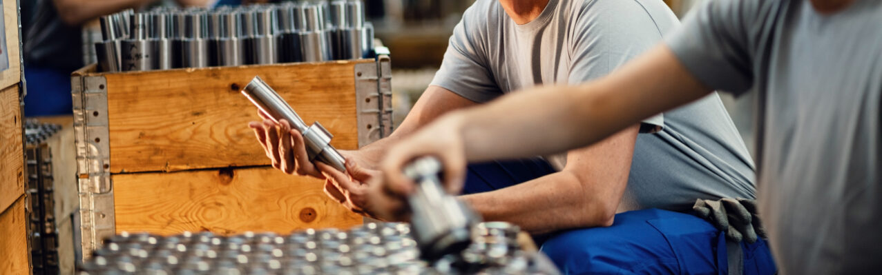 two-happy-steel-workers-preparing-manufacture-products-distribution-communicating-industrial-facility-focus-is-mid-adult-worker.jpg