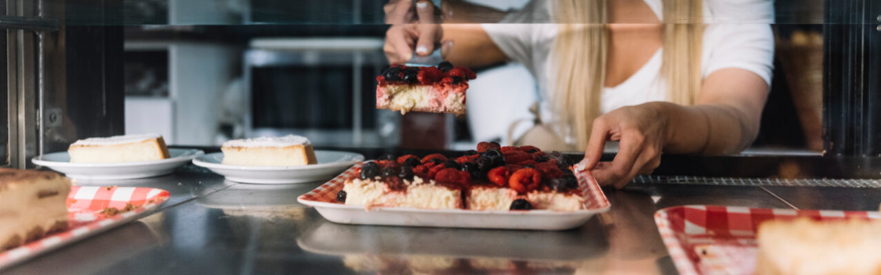 waitress-holding-berries-sponge-cake.jpg