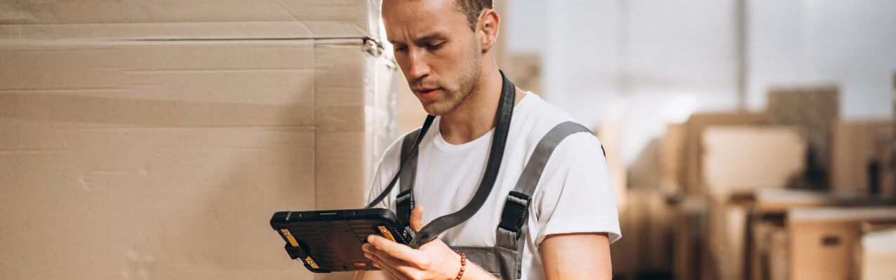 young-man-working-warehouse-with-boxes.jpg